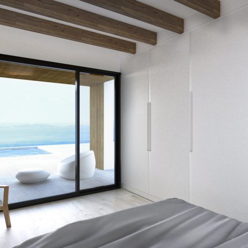 Dormitorio con acceso a piscina infinita y vistas al mar en vivienda modular proyectada por arquitecto Valencia