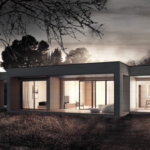 Vivienda modular pasiva iluminada de noche en entorno rural de Alcoy, proyectada por arquitecto Valencia