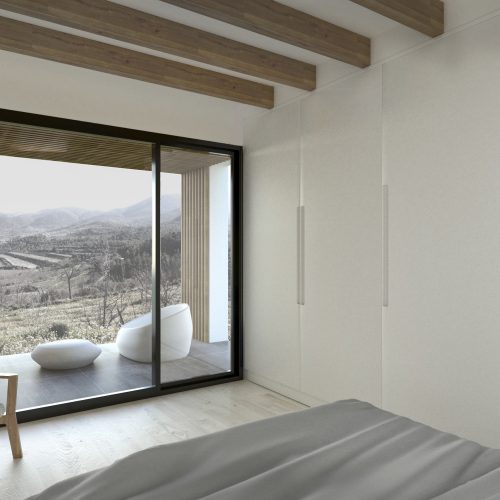 Dormitorio con salida a terraza y vistas abiertas al paisaje natural, proyectado por mejores arquitectos en Valencia